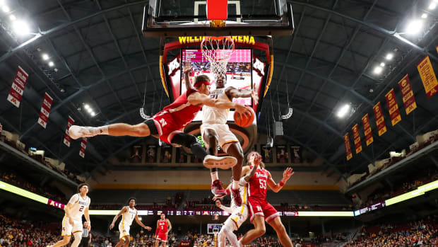 Nebraska's Sam Hoiberg tries to pass around Pharrel Payne